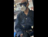 Guy wears empty container as face mask 