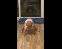 Baby tries to stand up does splits 