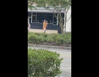 Couple orange shirt dance tiktok trash can