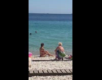Red bikini girl sits beach mom dress 