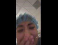 Girl blue hair net in bathroom fire alarm going off