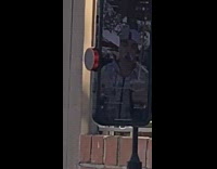 Man with money on his head and nose livestreams 