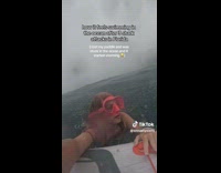 Collab ClipsIG - Woman paddleboarding stuck in ocean during storm 