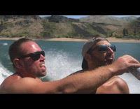 2 guys on a lake drink beer in slow motion 