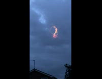Firework does loops across night sky