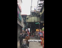 Guy climbs top of train subway tracks