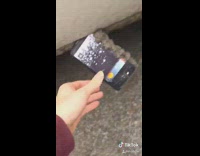 Girl phone stuck car door mud 