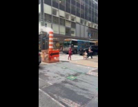 Woman red outfit poses with steam behind