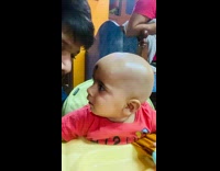 Confused baby checks to see if filter is real 