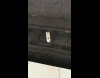 White skateboard dropped on train tracks 