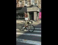 Man on bike makes bird cry sound on the street