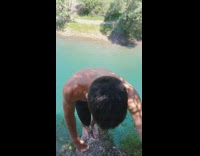 Guy dives from cliff into water 