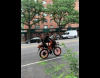 Man riding strange looking bike 