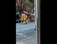 Traffic cone heads group dancing while walking
