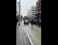 Car drives at bike lane during traffic