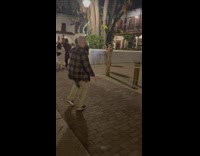 Woman hug pole with christmas lights street