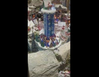 Miniature people on a drop tower in a miniature town