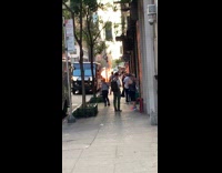 Fire on street behind parked van 