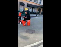 Jewish man reads book out loud on the street