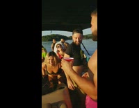 Woman in mesh pants and bikini and twerks to Act Up at a boat party