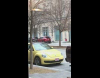 Two girls dance on sidewalk