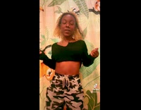 Girl dances in front of sloth shower curtain 