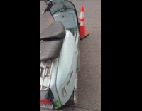 Scooters tire locked on traffic cone