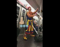 Clown on subway train blows up a balloon animal using his nose
