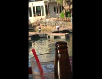 Woman white shirt blue coat sit boat dock