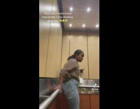 Woman in elevator scared with sudden shake