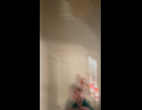 Boy flips the bottle on the wall