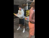 Guy gets back slapped with bat 