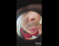Guy eats nugget in fisheye camera 