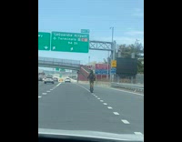 Guy rides electric scooter on road 