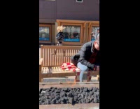 Woman puffer jacket walks for mall video