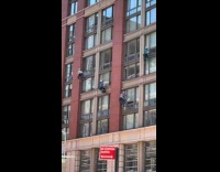 Window washers cleaning windows 