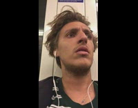 Businessman on subway asleep while slumped on floor