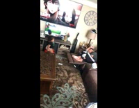 Baby throws toy at sleeping girl on couch