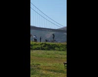 Black hat guy on table with whip 