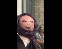 Bald man dressed as professor Quirrell for Halloween 