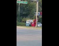 Woman twerk big read chair gas station