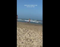 Brown bikini girl friend lays back beach 