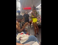 Two people with pet snakes in subway