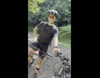 Man with black shirt releases steam from the heat