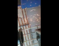 Guy gets hit with sparks during welding 