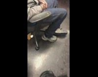 Guy with green face mask rolls off roller chair and hits face on handlebar on subway