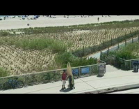 Collab Kook Of The Day - Red shirt guy brown surfboard in cart 