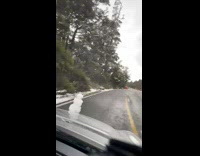 Person drive snowman on car hood timelapse