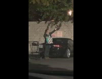 Blue reusable bag selfie guy parking lot 