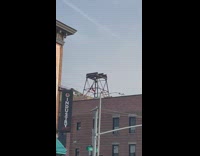 Gymnast Flips on Rooftop Structure 